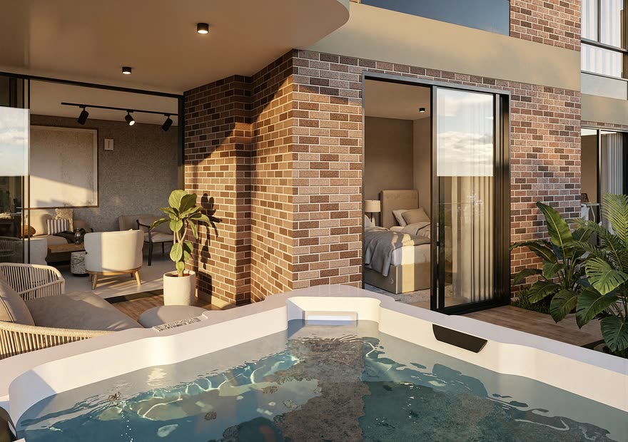 Terraza de un apartamento de Barlovento Living con jacuzzi privado y muro en ladrillo
